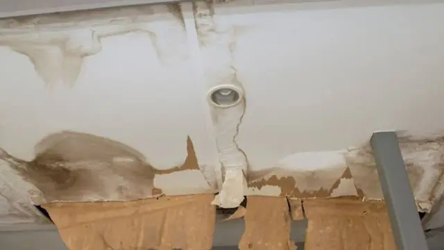 Water-stained ceiling around a light fixture